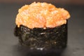 Close up of Gunkan Sushi. Gunkan Maki Sushi with Seafood, caviar and Spicy Sauce. Delicious Gunkan Sushi on black Royalty Free Stock Photo
