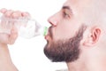 Close up with guy drinking water from plastic bottle Royalty Free Stock Photo