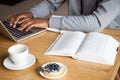 Close up of guy using laptop sitting in cafe Royalty Free Stock Photo