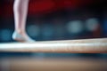 Close-up of a gymnast\'s feet on a balance beam, blurred background Royalty Free Stock Photo