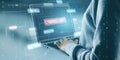 Close up of hacker hands using laptop with glowing hacking hologram with binary code and lines. Cybersecurity, firewall, Royalty Free Stock Photo