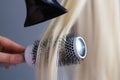 simple minimalist photo, blow dry hair styling. Close-up of hair dryer, concept cut salon, female stylist. Royalty Free Stock Photo