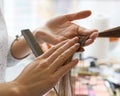 Close-up of hairdresser hairstylist female hand with hair mousse spray. Royalty Free Stock Photo