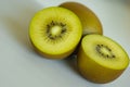 Close up of half cutted kiwifruits from New Zealand. Background of fresh and juicy golden green kiwis for healthy smoothies