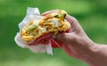 Close-up of a half-eaten burger in hand Royalty Free Stock Photo
