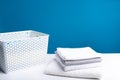 Washed linens on table together with laundry box Royalty Free Stock Photo