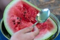 Close up half fresh and red watermelon fruit with spoon on table background Royalty Free Stock Photo