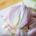 Close-up of half a raw purple onion. Chopped onion. Vegetarian healthy food. Chopped vegetables. Shallow depth of field.