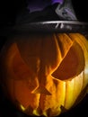 Close up on halloween pumpkin and its wizard hat Royalty Free Stock Photo