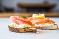 close-up of a halved bagel with cream cheese and lox Royalty Free Stock Photo