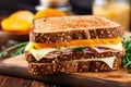 close-up of a ham and cheese sandwich on whole wheat bread Royalty Free Stock Photo
