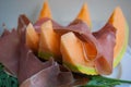 Close-up of ham and orange melon