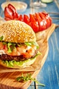 Close up on hamburger and lobster on table Royalty Free Stock Photo