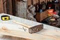 Close-up of hammer and nails on a wooden board. Construction, carpentry