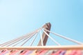 Close-up of hammock ropes and wooden post with clear blue sky in the background Royalty Free Stock Photo