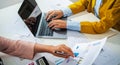 close up hand accountant holding pen pointing on paperwork chart for meeting team in office room. concept finance and accounting Royalty Free Stock Photo