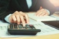 close up hand accountant using calculator with laptop. concept s Royalty Free Stock Photo
