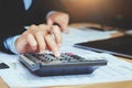 close up hand accountant using calculator with laptop. concept s Royalty Free Stock Photo