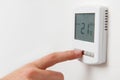 Close Up Of Hand Adjusting Digital Central Heating Thermostat Co Royalty Free Stock Photo