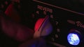 Close up of Hand adjusting Reverb of Guitar Amplifier
