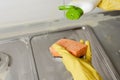 Extruding the detergent onto the sponge, close-up