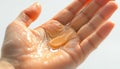 Close-up of a hand applying sunscreen, white background Royalty Free Stock Photo