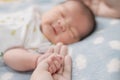 Close-up hand the asian New born baby in the hand of mother Royalty Free Stock Photo