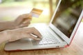 Close up hand of Asian woman using credit card for onClose up hand of Asian woman using credit card for online shoppingline shoppi Royalty Free Stock Photo