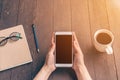 Close up hand asian woman using phone in coffee shop and sunlight with vintage filter. Royalty Free Stock Photo