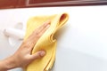 Close up hand auto service staff cleaning white car Worker with microfiber Royalty Free Stock Photo