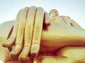 Close up hand of big Buddha statue with blue sky at Wat Tha Muang Thailand. The most specifically iconic Golden Buddha statues Royalty Free Stock Photo