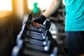 Close up hand bodybuilder lifting dumbbell weights at fitness gym. Exercise is the Lifestyles of healthy Royalty Free Stock Photo