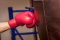 Close-up hand of boxer at the moment of impact on punching bag