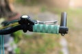 Close up hand brake mountain bike handle caliper bicycle blurred tree background for Exercise for health image