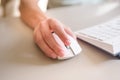 Close up hand man using mouse and computer at home with morning light Royalty Free Stock Photo