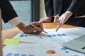 Close up hand of business people holding pen pointing financial Royalty Free Stock Photo