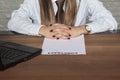 Close-up on the hand of a business woman, empty contract to sign