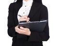 Close up hand of business woman writing on a clipboard isolated Royalty Free Stock Photo