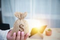 Close-up hand businessman holding a sack of money dollar. Royalty Free Stock Photo