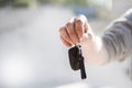 Close up hand of businessman man holding and give the remote control car systems.