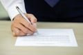 Close up hand of businessman writing with paperwork. Royalty Free Stock Photo