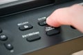 Close-up hand button open the photocopier. Royalty Free Stock Photo