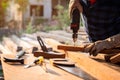 Close up hand of Carpenter drills wood a hole with an electrical drill Royalty Free Stock Photo