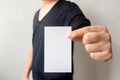 Close up hand of casual man black shirt holding business card on Royalty Free Stock Photo