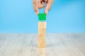 Close-up hand choose a cube shape wooden block toy stacked without graphics for Business design concept Royalty Free Stock Photo