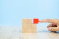 Close-up hand choose a cube shape wooden block toy stacked without graphics for Business design concept and activity for child fou Royalty Free Stock Photo