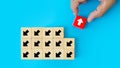 Close-up hand choose cube wooden toy block stacked with arrow icon pointing to opposite directions for way of business change Royalty Free Stock Photo