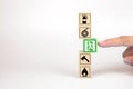 Close-up hand choose a wooden toy blocks with fire exit icon Royalty Free Stock Photo