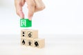 Close-up hand choose wooden toy blocks stacked with door exit sing icon Royalty Free Stock Photo
