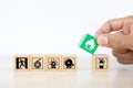 Close-up hand choose wooden toy blocks stacked with fire prevent icon Royalty Free Stock Photo